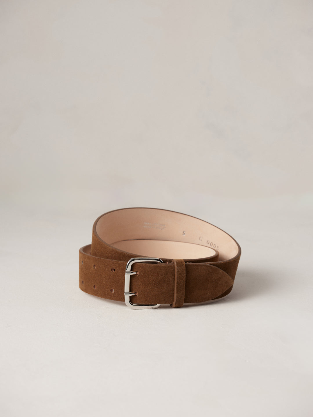 Déhanche Hutch Suede Belt - Elegant brown suede belt with a sleek silver buckle, featuring precise stitching and a minimalist design for timeless style.
