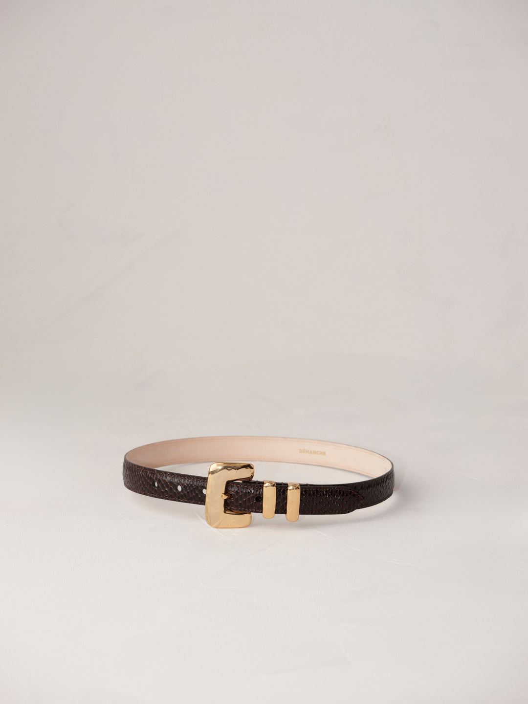 Elegant and stylish women's fashion accessory. High-quality and chic statement piece. Italian sourced leather. Calfskin suede. Silver hardware. 24k gold. Luxury. Déhanche.