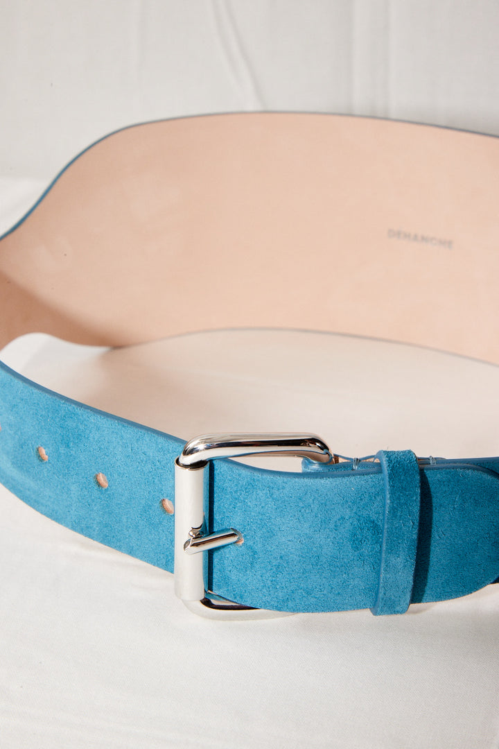 Déhanche boleyn wide turquoise suede belt with silver buckle. Elegant and stylish women's fashion accessory. High-quality and chic statement piece.