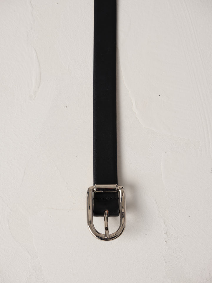 Déhanche Mija black leather belt with silver buckle, displayed against a light background.