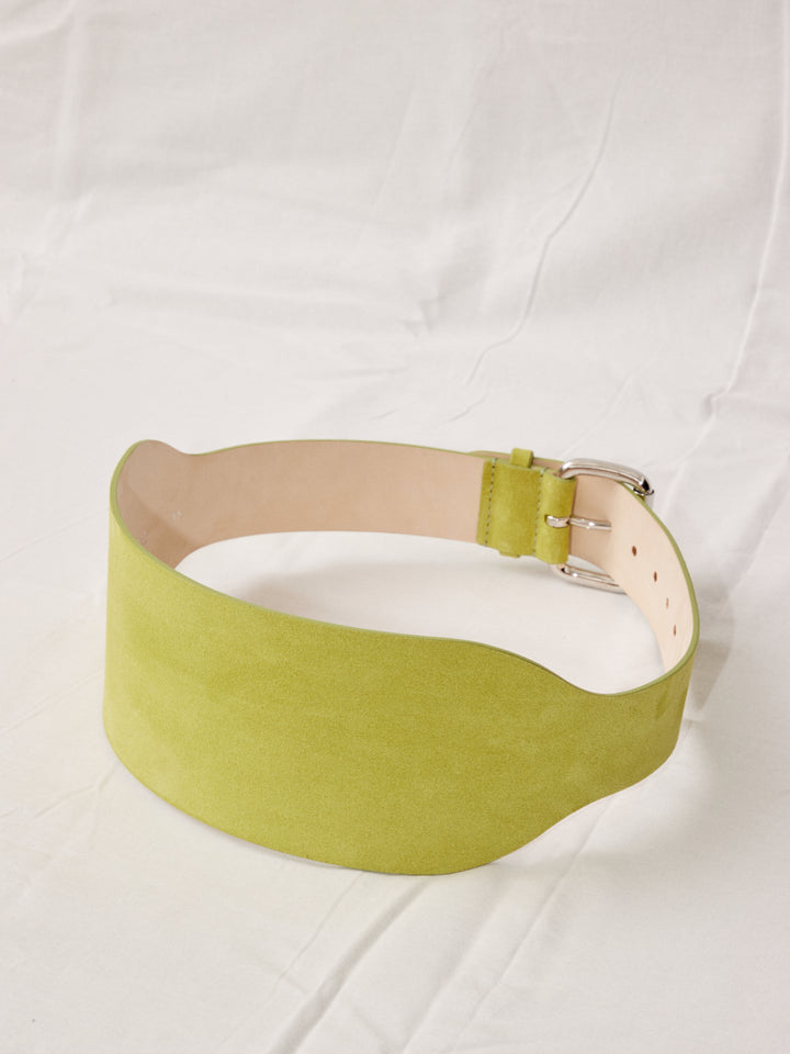 Déhanche boleyn wide yellow suede belt with silver buckle. Elegant and stylish women's fashion accessory. High-quality and chic statement piece.