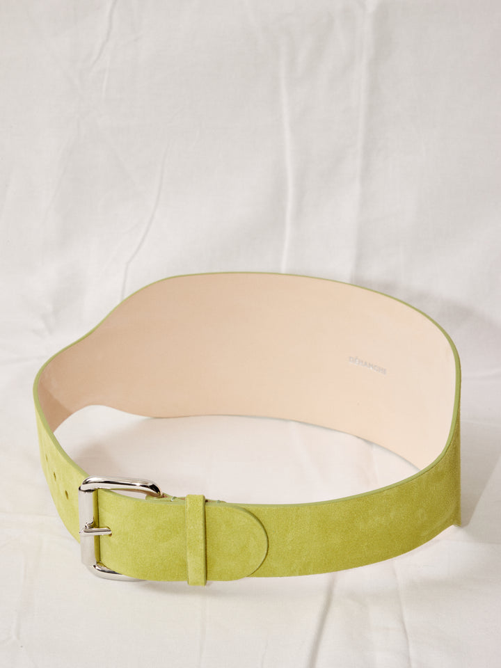 Déhanche boleyn wide yellow suede belt with silver buckle. Elegant and stylish women's fashion accessory. High-quality and chic statement piece.