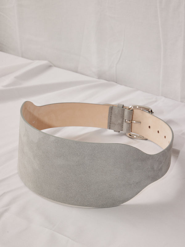 Déhanche boleyn wide grey suede belt with silver buckle. Elegant and stylish women's fashion accessory. High-quality and chic statement piece.