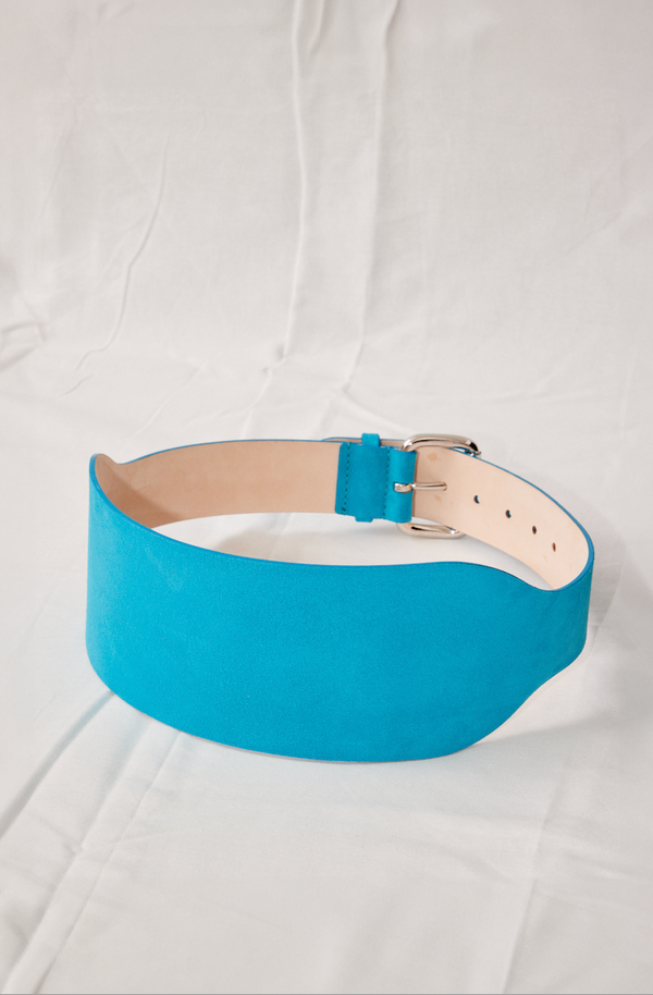 Déhanche boleyn wide turquoise suede belt with silver buckle. Elegant and stylish women's fashion accessory. High-quality and chic statement piece.