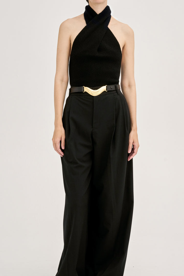Déhanche brancusi halter top and wide-leg pants in black. Elegant and stylish women's fashion outfit with gold belt accent. High fashion statement.