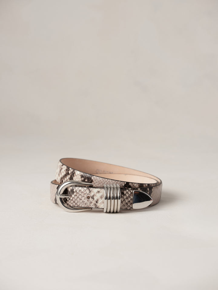 Déhanche Hollyhock Snake Belt - Elegant snake print leather belt with silver buckle and accents. Perfect for adding a bold, sophisticated touch to any outfit.