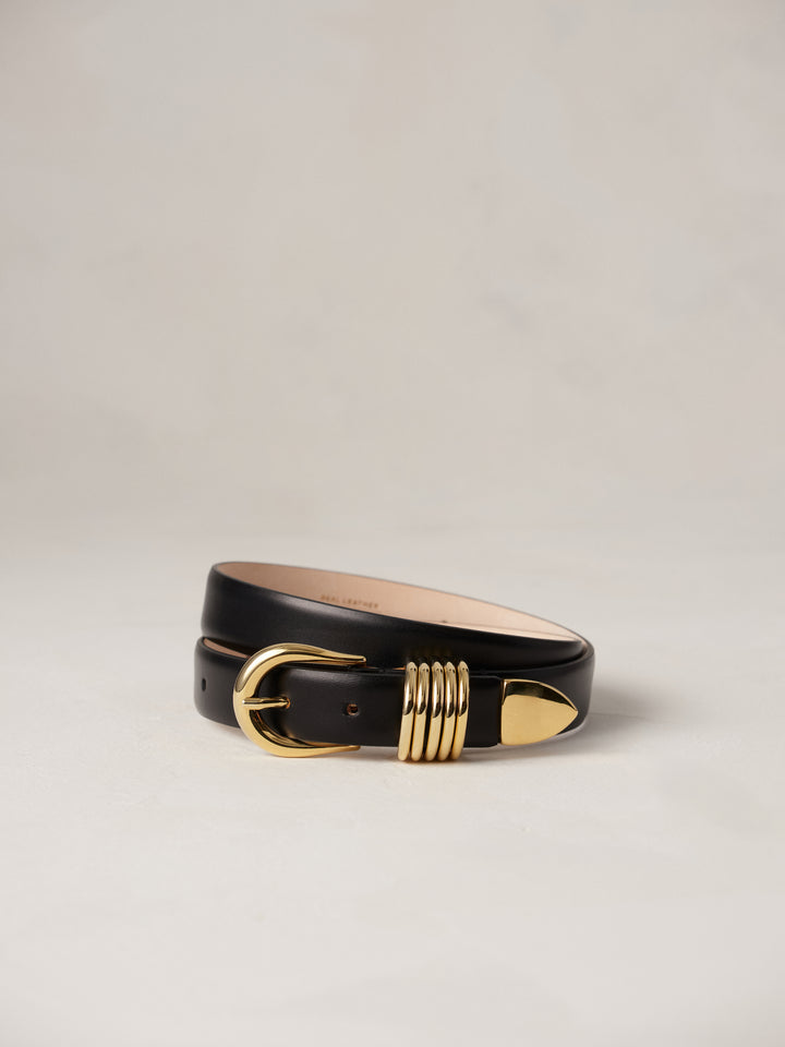 Déhanche Hollyhock Gold Belt - Elegant black leather belt with a gold buckle and accents. Perfect for adding a touch of sophistication to any outfit.