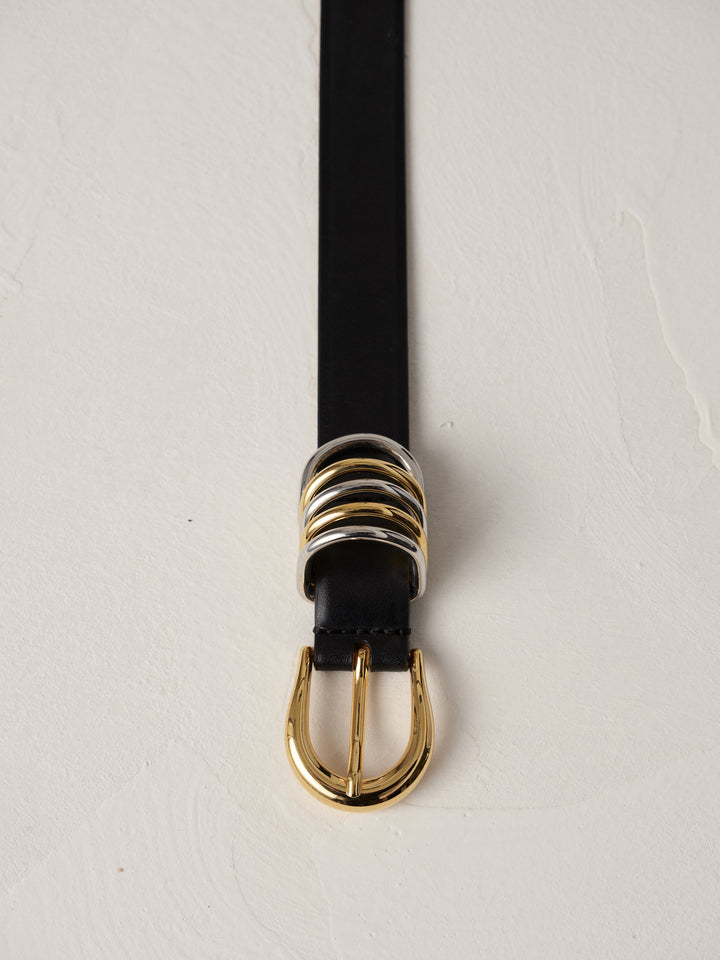 Déhanche Hollyhock Mixed Metal Belt - Elegant black leather belt with a mixed metal gold and silver buckle. Perfect for adding a unique touch of sophistication.