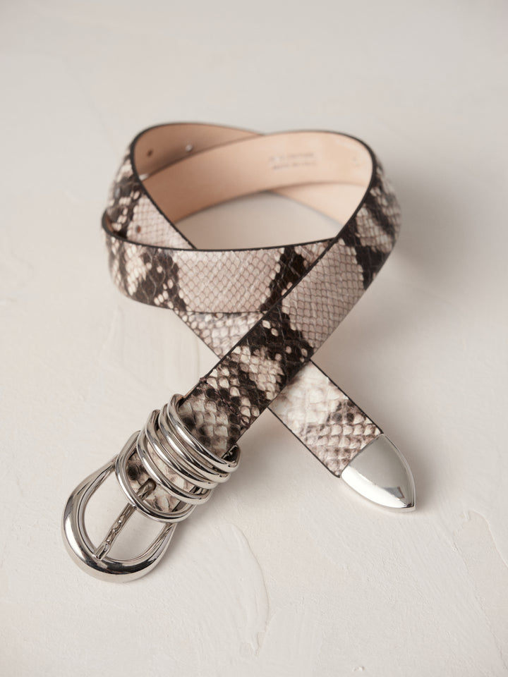 Déhanche Hollyhock Snake Belt - Elegant snake print leather belt with silver buckle and accents. Perfect for adding a bold, sophisticated touch to any outfit.