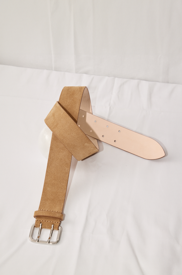 Déhanche hutch wide caramel suede belt with silver buckle. Elegant and stylish women's fashion accessory. High-quality and chic statement piece.