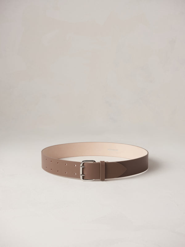 Déhanche Hutch Leather Belt - Elegant taupe leather belt with a sleek silver buckle. Perfect for adding a touch of refined sophistication to any outfit.