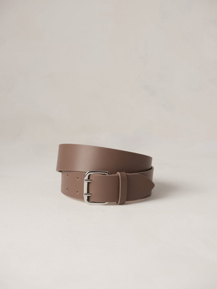 Déhanche Hutch Leather Belt - Elegant taupe leather belt with a sleek silver buckle. Perfect for adding a touch of refined sophistication to any outfit.