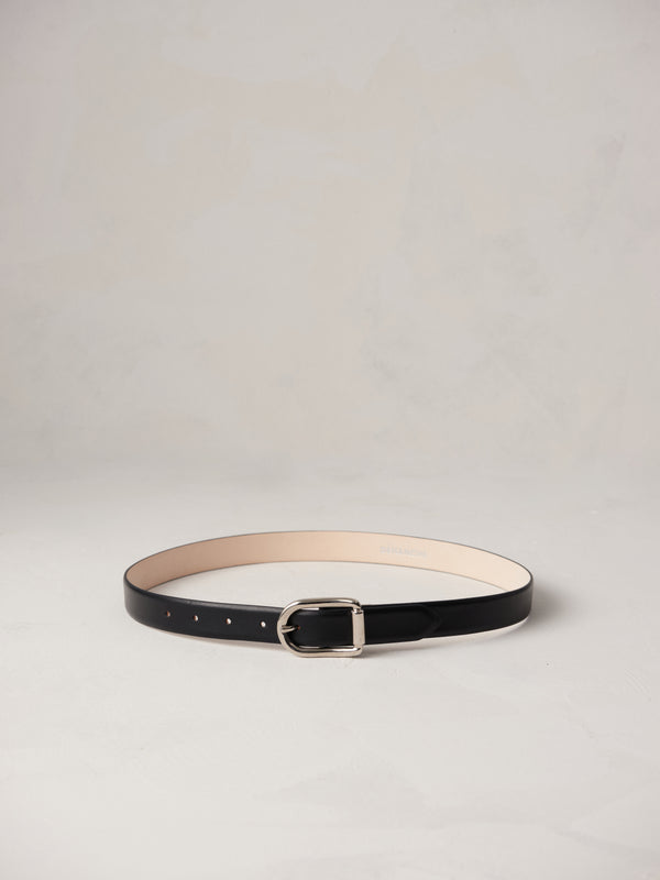 Déhanche Mija black leather belt with silver buckle, displayed against a light background.